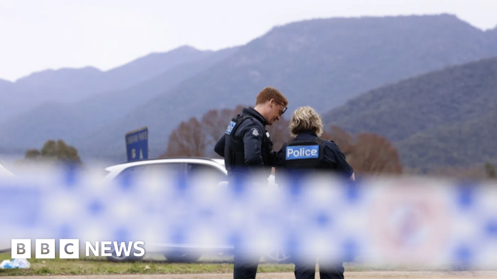 Australia police shooting suspect named as manhunt continues