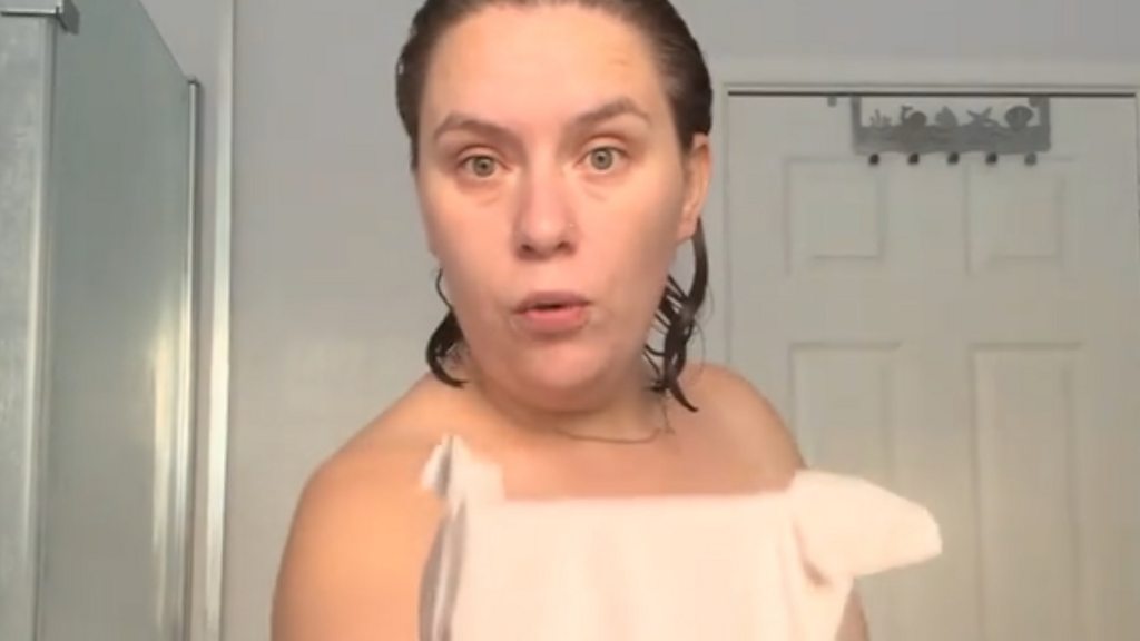 Woman goes viral after delivery photo catches her in just a towel - BBC