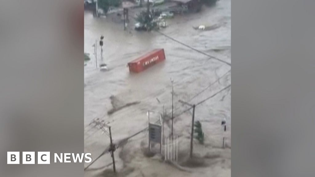 Shipping containers swept away in deadly Philippines floods